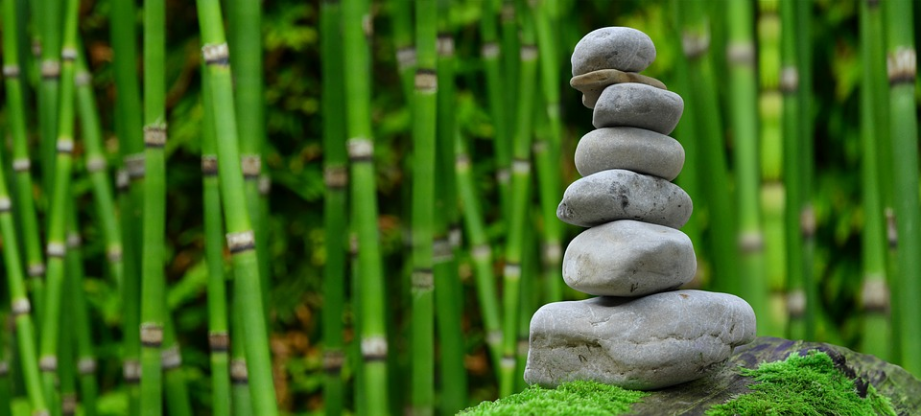a stack of stones and bamboos